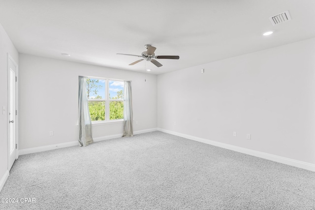 carpeted empty room with ceiling fan