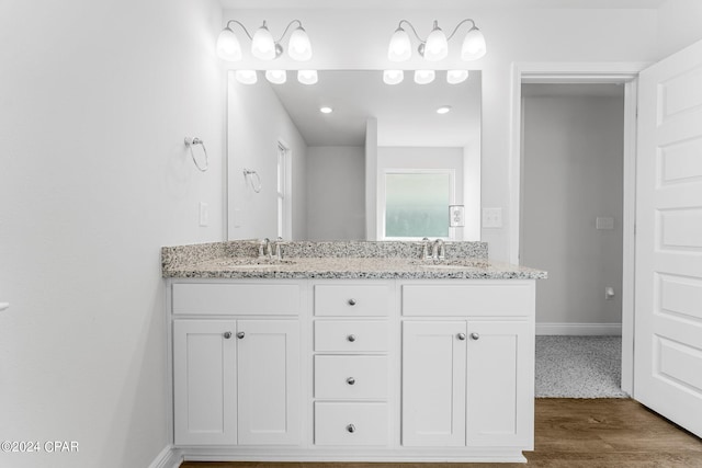 bathroom featuring vanity and hardwood / wood-style floors