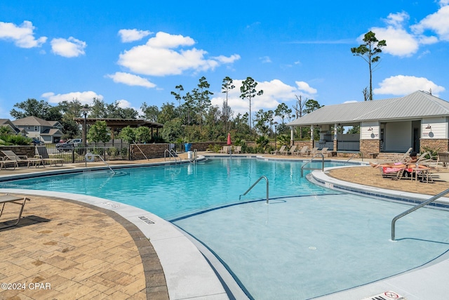 view of swimming pool with a patio area