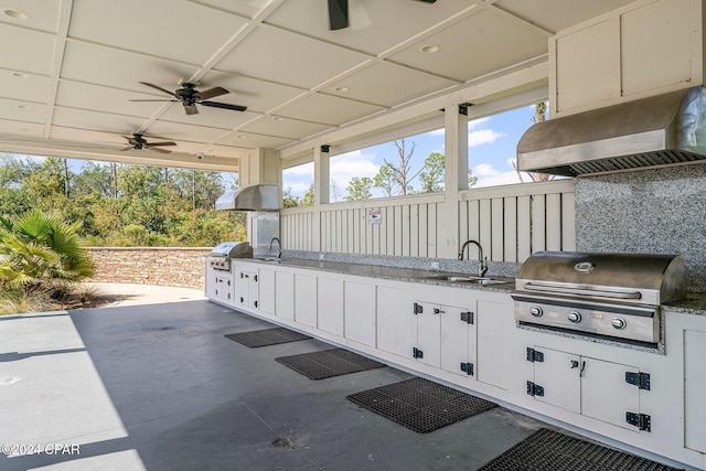 view of patio / terrace with grilling area, sink, and ceiling fan