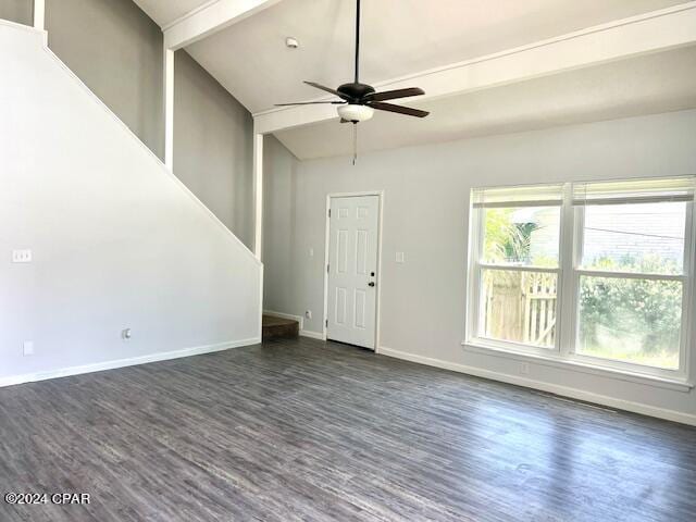 unfurnished living room with lofted ceiling with beams, dark wood-type flooring, a ceiling fan, and baseboards