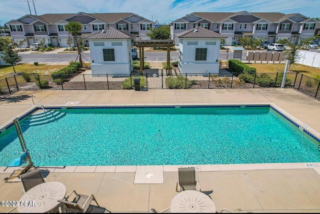 view of swimming pool featuring a pergola