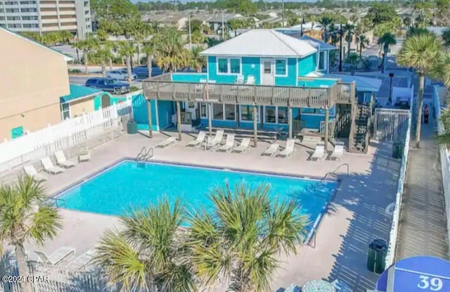 view of swimming pool with a patio