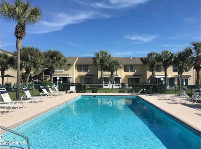 view of swimming pool featuring a patio area