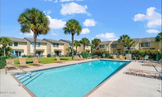 view of swimming pool with a patio area