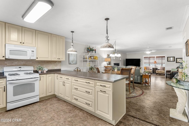 kitchen featuring decorative backsplash, cream cabinetry, ornamental molding, and white appliances