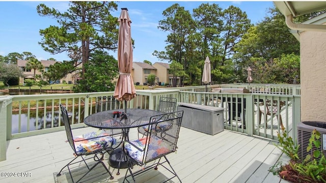 deck featuring a water view and central AC unit