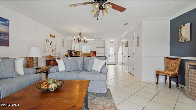 tiled living room featuring ceiling fan with notable chandelier and crown molding