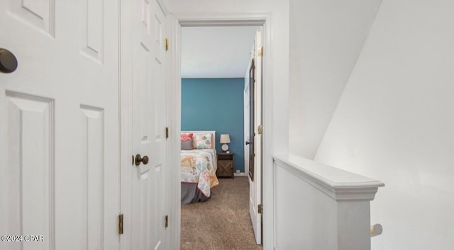 hallway with light colored carpet