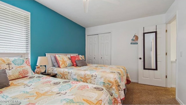 bedroom featuring ceiling fan, carpet floors, and a closet