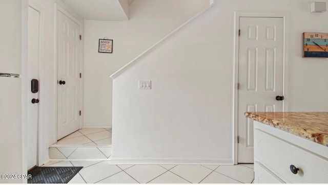 interior space with light tile patterned floors