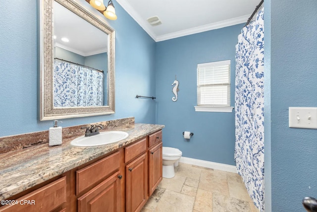 bathroom with vanity, crown molding, and toilet