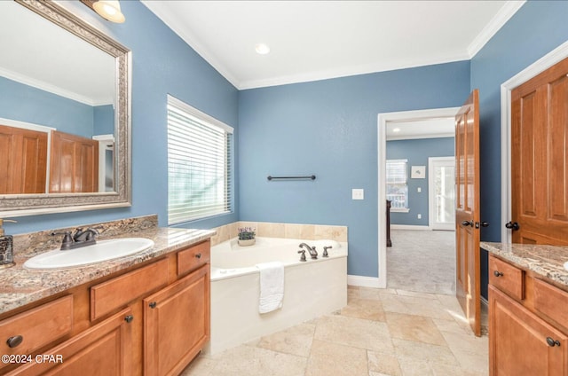 bathroom featuring vanity, a tub to relax in, and crown molding