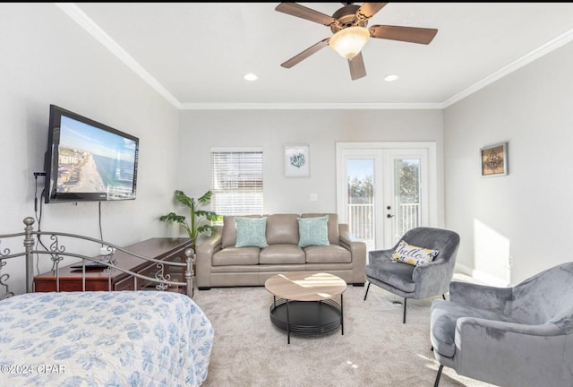 bedroom featuring ceiling fan, ornamental molding, access to exterior, and multiple windows