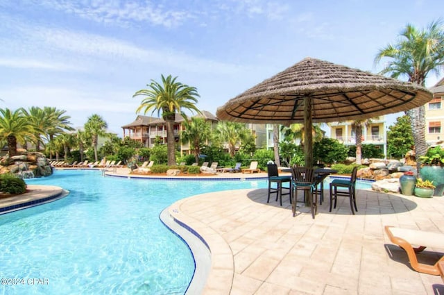 view of swimming pool with a patio