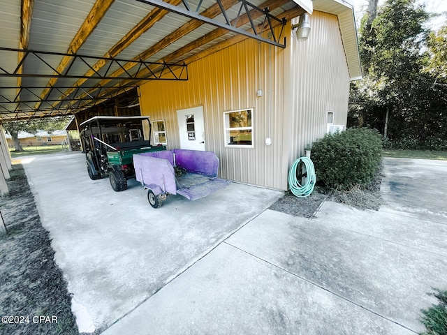 view of home's exterior with a carport