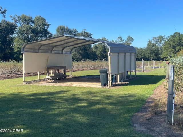 view of car parking featuring a yard and a carport