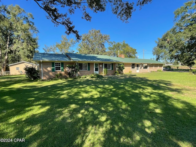 back of house with a yard