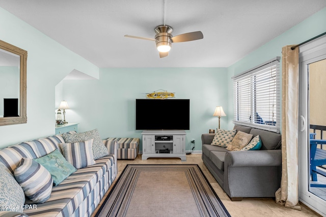 tiled living room with ceiling fan