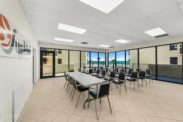 dining space featuring a drop ceiling