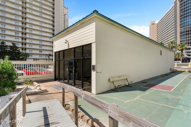 exterior space featuring basketball hoop