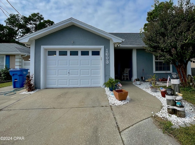 ranch-style home featuring a garage