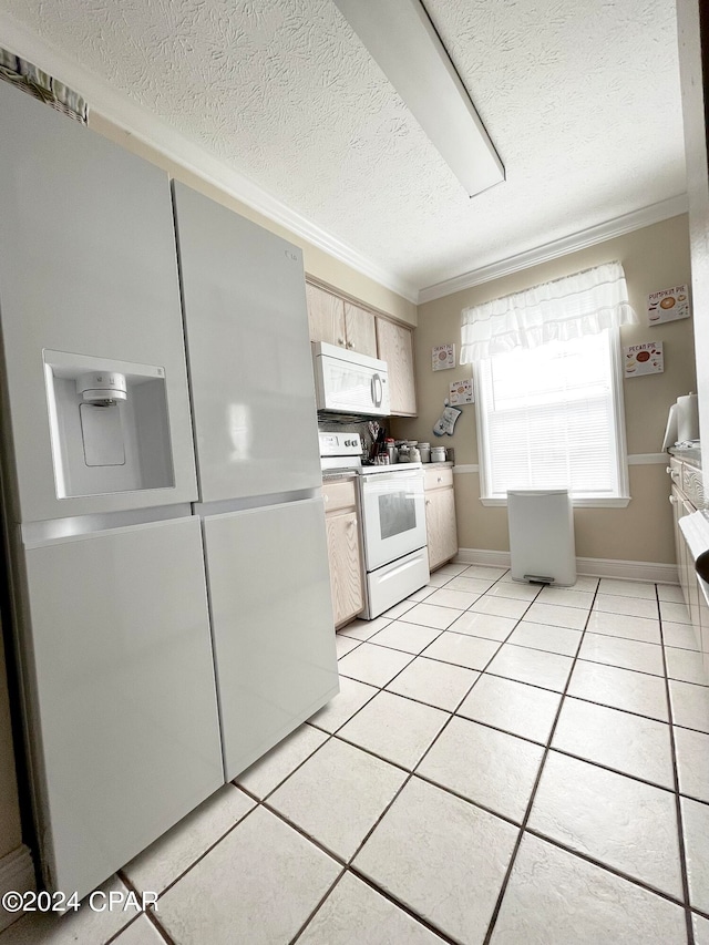 kitchen featuring a textured ceiling, white appliances, ornamental molding, and light tile patterned floors