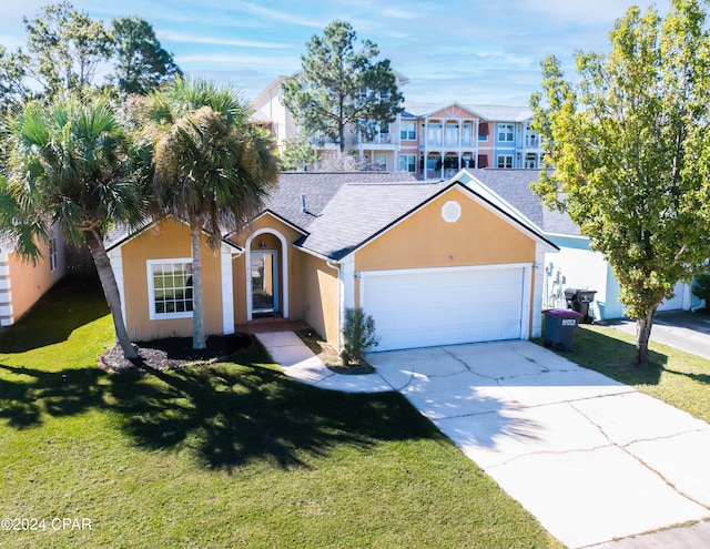 single story home featuring a front yard and a garage