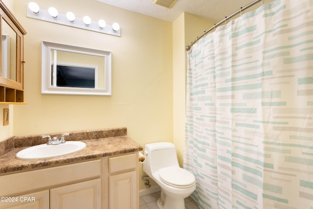 bathroom featuring a textured ceiling, toilet, vanity, curtained shower, and tile patterned floors