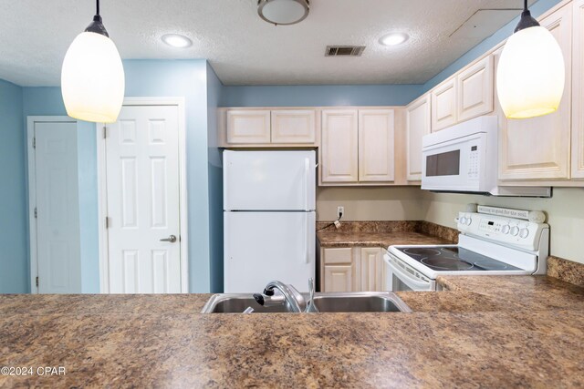 kitchen with sink, a textured ceiling, pendant lighting, and white appliances