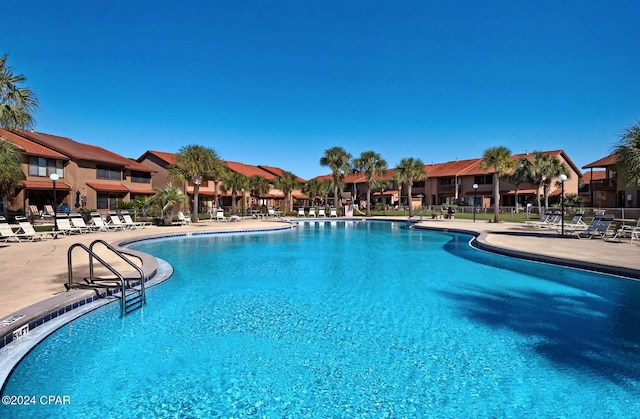 view of swimming pool featuring a patio area