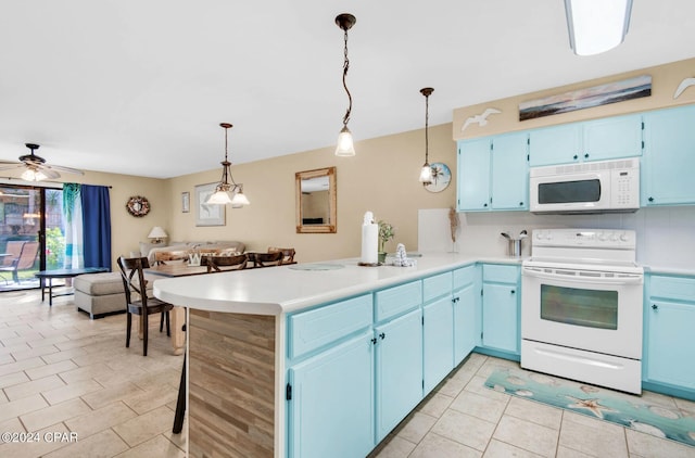 kitchen featuring blue cabinets, kitchen peninsula, decorative light fixtures, white appliances, and light tile patterned flooring