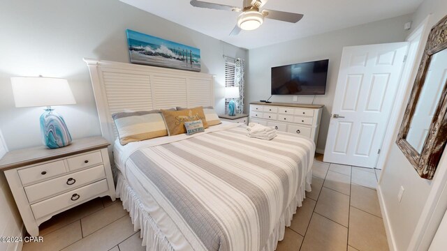 bedroom with ceiling fan and light tile patterned floors