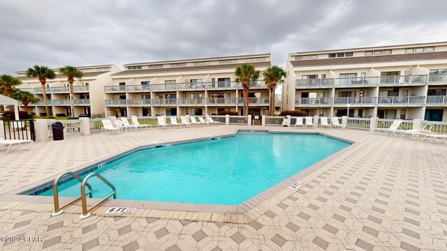 view of pool featuring a patio