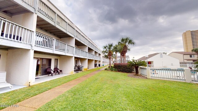 view of yard with a patio and a fenced in pool