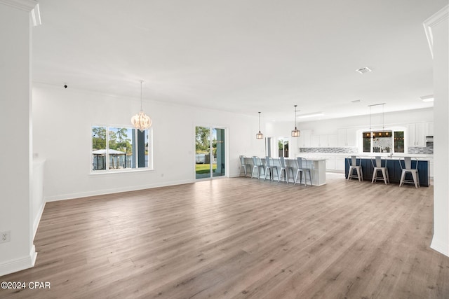 unfurnished living room with hardwood / wood-style flooring