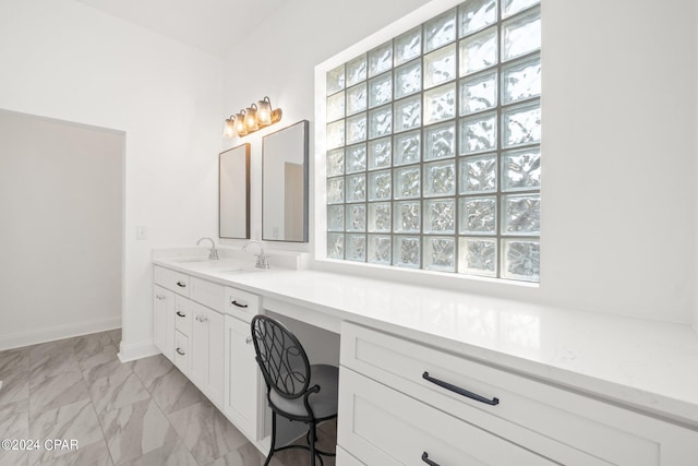 bathroom with vanity and a healthy amount of sunlight