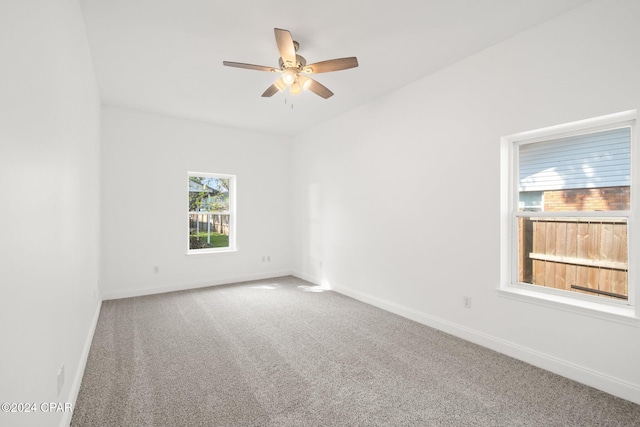 empty room with carpet floors and ceiling fan