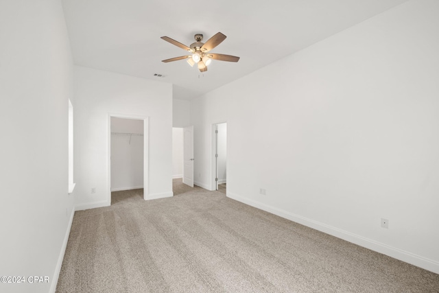 unfurnished bedroom with ceiling fan and light carpet