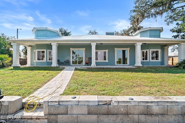 view of front of house featuring a front yard and covered porch