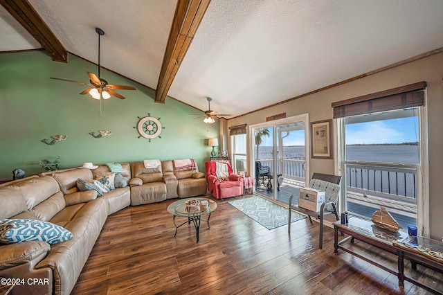 living room featuring dark hardwood / wood-style floors, a water view, lofted ceiling with beams, a textured ceiling, and ceiling fan