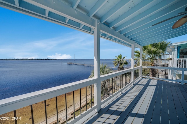 deck featuring a water view and a ceiling fan