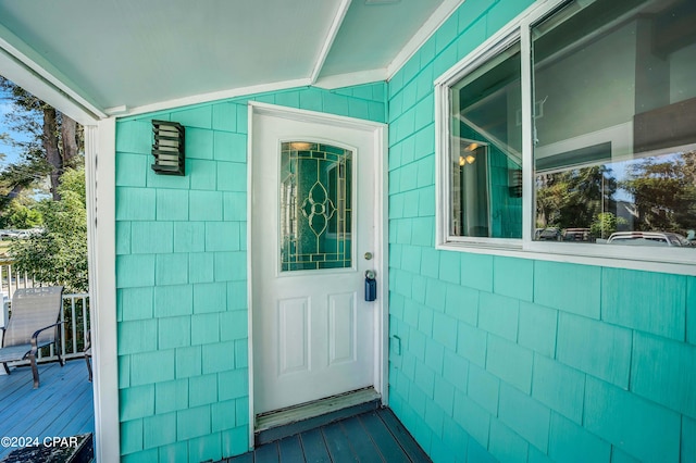 property entrance with a wooden deck