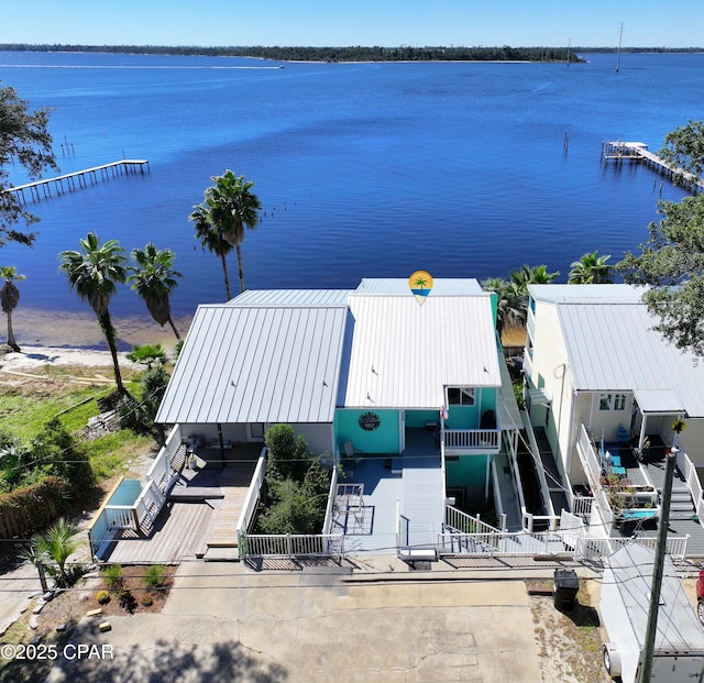 birds eye view of property featuring a water view