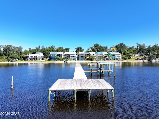 dock area featuring a water view and boat lift