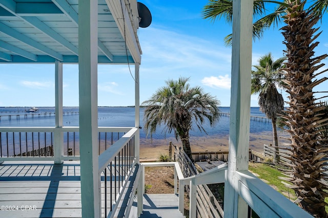 wooden deck featuring a water view