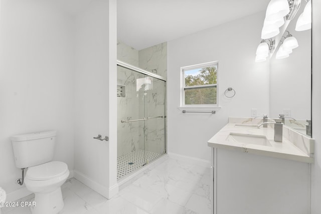 bathroom featuring toilet, vanity, and a shower with door