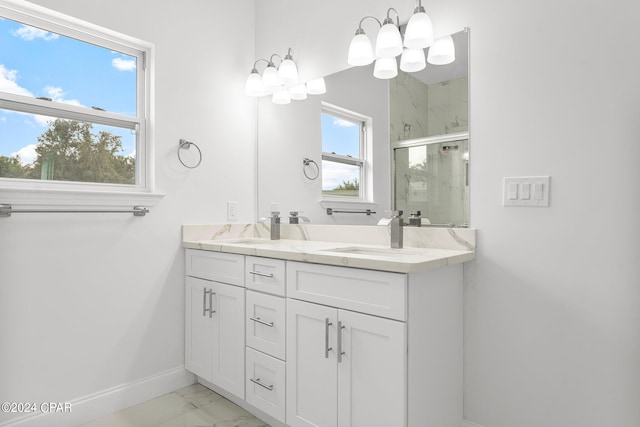 bathroom featuring vanity and an enclosed shower