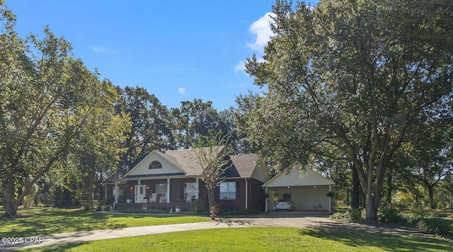 view of front of property with a carport and a front yard