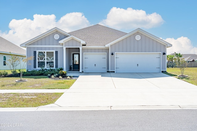 view of front facade with a front lawn and a garage